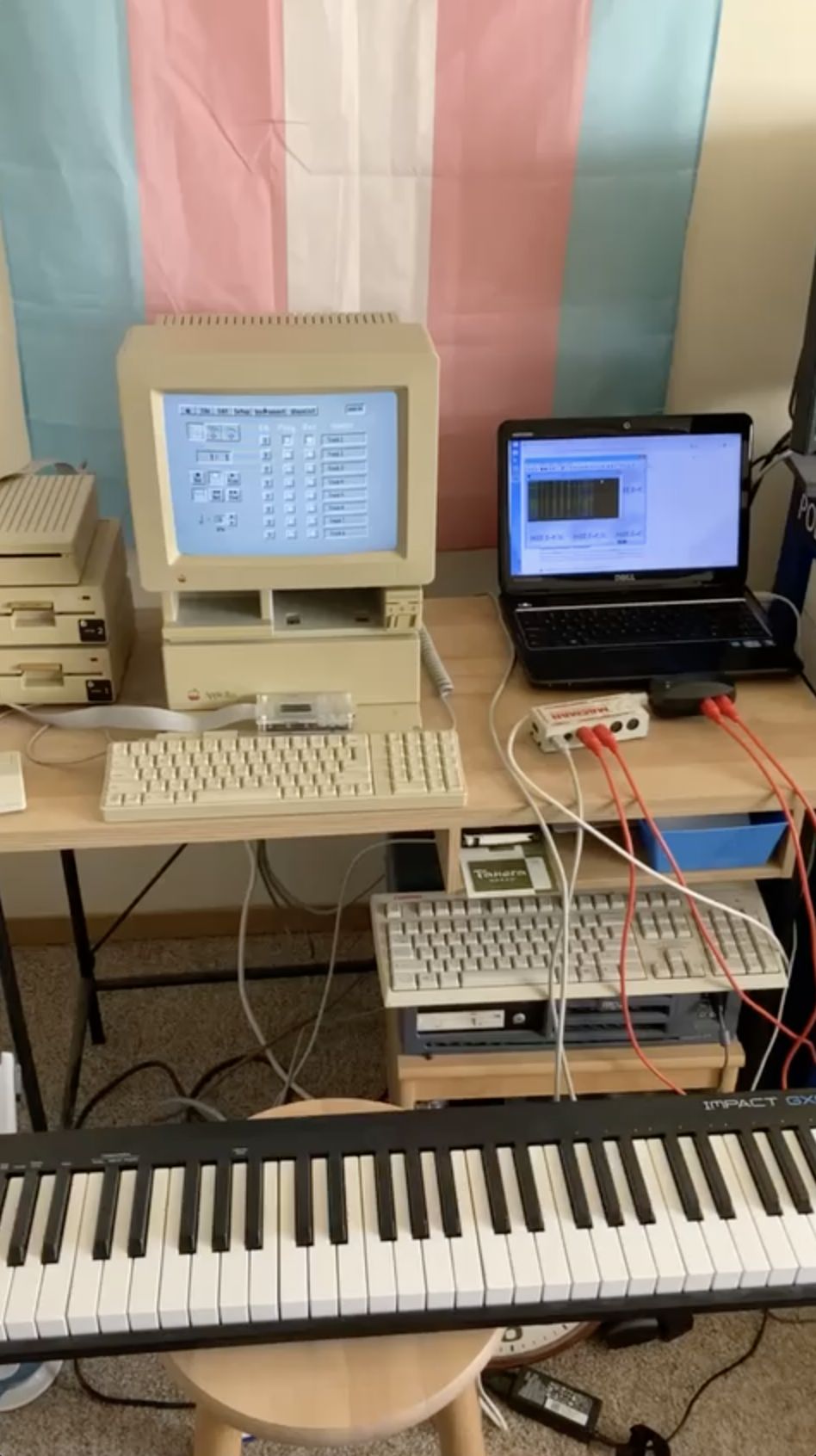 A photo showing an Apple IIGS running synthLAB, a Midiman Macman, a M-Audio Midisport 1x1, and a laptop running MIDI-OX